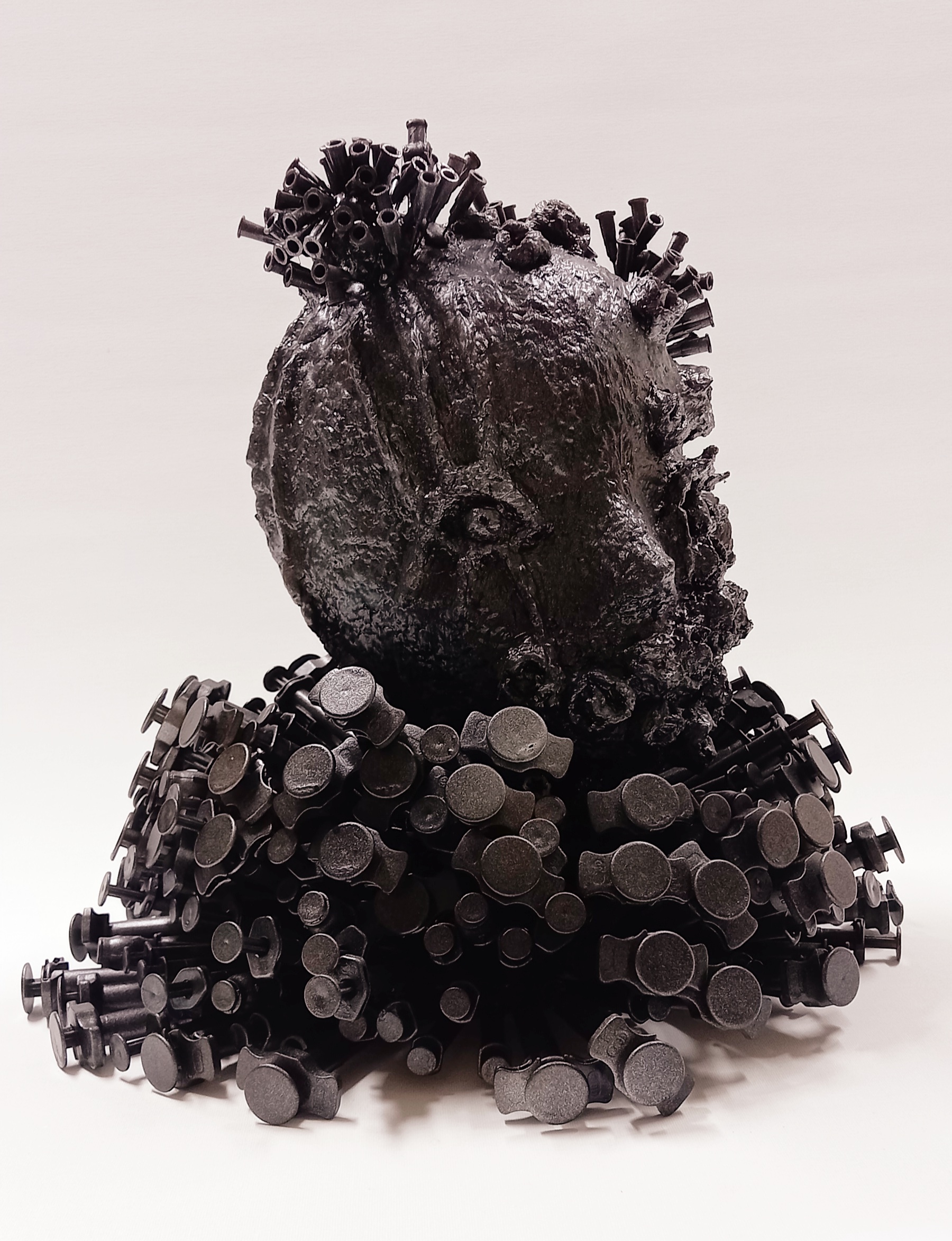 Shani Eldar, Injected, 2009, Syringes and injection needles, styrofoam head coated with paper mâché and acrylic paint, 35x33 cm